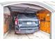 View of the inside of a garage with a black SUV parked inside at 1300 Park West Blvd # 215, Mount Pleasant, SC 29466