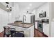 Inviting kitchen with a breakfast bar and stainless steel appliances at 1300 Park West Blvd # 215, Mount Pleasant, SC 29466