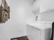 Efficient laundry area with modern machines and upper storage at 1300 Park West Blvd # 215, Mount Pleasant, SC 29466