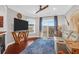 Cozy living room offers plush seating, an entertainment center, and natural light at 1300 Park West Blvd # 215, Mount Pleasant, SC 29466