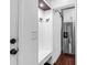 Handy mud room boasts modern fixtures and opens with a sliding barn door at 1300 Park West Blvd # 215, Mount Pleasant, SC 29466
