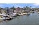 An aerial view of waterfront property and boat docks on a calm river at 1305 Old Rice Mill Rd, Moncks Corner, SC 29461