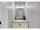 Bathroom vanity with granite counters, framed mirror, and nautical décor at 1305 Old Rice Mill Rd, Moncks Corner, SC 29461