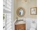 Chic powder room featuring a stylish vanity, a decorative mirror, and elegant fixtures, adding a touch of luxury at 1305 Old Rice Mill Rd, Moncks Corner, SC 29461