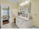 Charming bathroom with granite counters and views into the primary bedroom at 1305 Old Rice Mill Rd, Moncks Corner, SC 29461