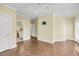 Spacious primary bedroom featuring hardwood floors, crown molding and ensuite bathroom at 1305 Old Rice Mill Rd, Moncks Corner, SC 29461