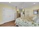 Comfortable bedroom with hardwood floors, closet, and white trim at 1305 Old Rice Mill Rd, Moncks Corner, SC 29461