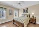 Comfortable bedroom with a large window, ceiling fan, hardwood floors and a well-lit space at 1305 Old Rice Mill Rd, Moncks Corner, SC 29461
