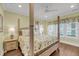 Beautiful bedroom features a four-poster bed, ceiling fan and lots of natural light from the windows at 1305 Old Rice Mill Rd, Moncks Corner, SC 29461