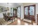 Elegant dining room featuring a formal dining set, a china cabinet, and a grand entrance, ideal for hosting gatherings at 1305 Old Rice Mill Rd, Moncks Corner, SC 29461