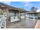 Outdoor dock featuring swing, metal roof, boat lift, and scenic waterfront views for easy boat access at 1305 Old Rice Mill Rd, Moncks Corner, SC 29461