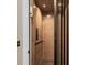 Interior of the private elevator with wood panels and black metal doors at 1305 Old Rice Mill Rd, Moncks Corner, SC 29461