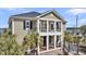 Inviting home with a covered porch, perfect for enjoying the outdoors, surrounded by lush greenery and well-maintained landscaping at 1305 Old Rice Mill Rd, Moncks Corner, SC 29461