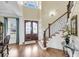 Grand foyer with hardwood flooring, an ornate staircase, and a striking double-door entrance, creating an inviting ambiance at 1305 Old Rice Mill Rd, Moncks Corner, SC 29461