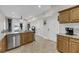 Bright, open kitchen area with stainless steel dishwasher and natural wood cabinets at 1305 Old Rice Mill Rd, Moncks Corner, SC 29461