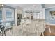 Open-concept kitchen offers a center island with bar seating, stainless steel appliances and ample counter space at 1305 Old Rice Mill Rd, Moncks Corner, SC 29461