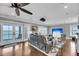Bright living room with hardwood floors, a ceiling fan, and water views from the French doors at 1305 Old Rice Mill Rd, Moncks Corner, SC 29461