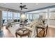 Bright living room featuring a lake view, hardwood floors, and an open layout with kitchen access at 1305 Old Rice Mill Rd, Moncks Corner, SC 29461