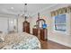Bedroom with hardwood floors, a four-poster bed, water views, and crown molding at 1305 Old Rice Mill Rd, Moncks Corner, SC 29461
