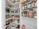 Walk-in pantry with floor-to-ceiling shelving provides abundant storage for all your culinary needs at 1305 Old Rice Mill Rd, Moncks Corner, SC 29461