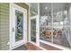 Screened porch access via door with decorative heron etching adds elegance and charm to the space at 1305 Old Rice Mill Rd, Moncks Corner, SC 29461