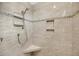 A tiled shower with a built-in seat, modern fixtures and a tiled storage niche at 1305 Old Rice Mill Rd, Moncks Corner, SC 29461