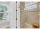 Bathroom featuring tiled shower with bench and a window at 1305 Old Rice Mill Rd, Moncks Corner, SC 29461