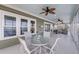 Spacious sunroom offers plenty of room, ceiling fans, and comfortable seating with great natural light at 1305 Old Rice Mill Rd, Moncks Corner, SC 29461