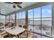 Bright and airy sunroom features panoramic waterfront views and comfortable seating, perfect for relaxing at 1305 Old Rice Mill Rd, Moncks Corner, SC 29461