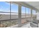 Enclosed sunroom with ample windows providing water views and an inviting sitting area at 1305 Old Rice Mill Rd, Moncks Corner, SC 29461