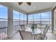 Enclosed sunroom featuring water views, ceiling fan, and a seating area perfect for relaxation at 1305 Old Rice Mill Rd, Moncks Corner, SC 29461