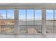 Enclosed sunroom with sliding glass windows overlooking water at 1305 Old Rice Mill Rd, Moncks Corner, SC 29461