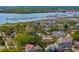 Ariel shot showcases the neighborhood, the river, boats, and bridges in a vibrant coastal community at 135 Beaufain St, Charleston, SC 29401