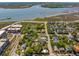 An aerial view displays a residential neighborhood near the river, bridges, and coast, highlighting the community's location at 135 Beaufain St, Charleston, SC 29401