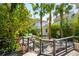 Scenic backyard with a charming water feature, lush greenery, and a view from the deck at 135 Beaufain St, Charleston, SC 29401