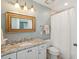 Updated bathroom features granite countertops, modern fixtures, and ample lighting at 135 Beaufain St, Charleston, SC 29401