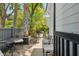 Inviting outdoor deck with comfortable seating, perfect for relaxation and entertaining amid lush foliage at 135 Beaufain St, Charleston, SC 29401