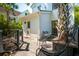 Exterior showcasing the back of the home with a wooden deck and views of the surrounding greenery at 135 Beaufain St, Charleston, SC 29401