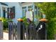 Exterior shot featuring an electric car charging station on a black fence at 135 Beaufain St, Charleston, SC 29401