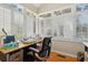 Bright home office with white shutters and vaulted ceilings at 135 Beaufain St, Charleston, SC 29401