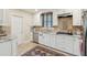 Updated kitchen features white cabinetry, stainless steel appliances, and granite countertops at 135 Beaufain St, Charleston, SC 29401