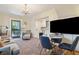 Cozy living area featuring a comfortable seating area, and a doorway leading to an outdoor patio space at 135 Beaufain St, Charleston, SC 29401