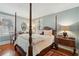Charming main bedroom with a four-poster bed and beautiful hardwood floors at 135 Beaufain St, Charleston, SC 29401