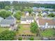 Aerial view of home showcasing large backyard with mature trees and landscaping in a neighborhood setting at 137 Cotillion Cres, Summerville, SC 29483