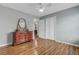 This bedroom features hardwood floors, a dresser, a mirror, and a closet at 137 Cotillion Cres, Summerville, SC 29483