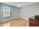 This bedroom features hardwood floors, a ceiling fan, a window, and light gray walls at 137 Cotillion Cres, Summerville, SC 29483