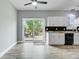 Bright kitchen showcases white cabinets, granite countertops, and access to a lovely backyard deck at 137 Cotillion Cres, Summerville, SC 29483