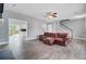 Spacious living room featuring wood-look floors, access to the backyard, and a view of the kitchen at 137 Cotillion Cres, Summerville, SC 29483