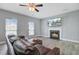 Spacious living room features natural light, classic fireplace, and ample room for comfortable seating at 137 Cotillion Cres, Summerville, SC 29483