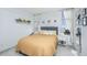 Bright and airy bedroom featuring a cozy bed, natural light, and minimalist decor at 14 Lockwood Dr # 9K, Charleston, SC 29401